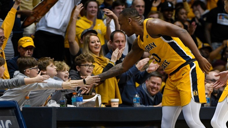 Feb 24, 2022; Murray, Kentucky, USA;  Murray State Racers forward KJ Williams (0) high fives fans as he walks down the court against the Belmont Bruins during second half at CFSB Center. Mandatory Credit: Steve Roberts-USA TODAY Sports