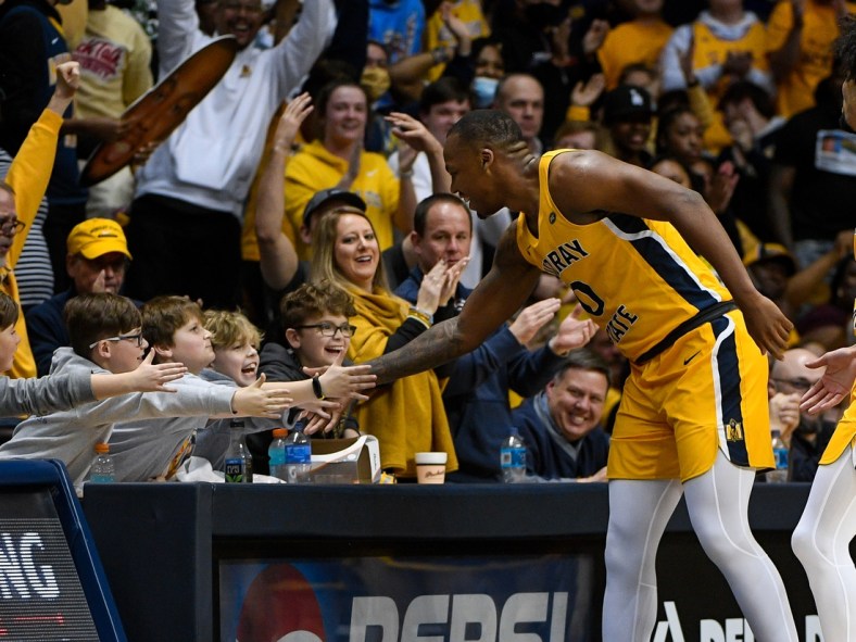 Feb 24, 2022; Murray, Kentucky, USA;  Murray State Racers forward KJ Williams (0) high fives fans as he walks down the court against the Belmont Bruins during second half at CFSB Center. Mandatory Credit: Steve Roberts-USA TODAY Sports
