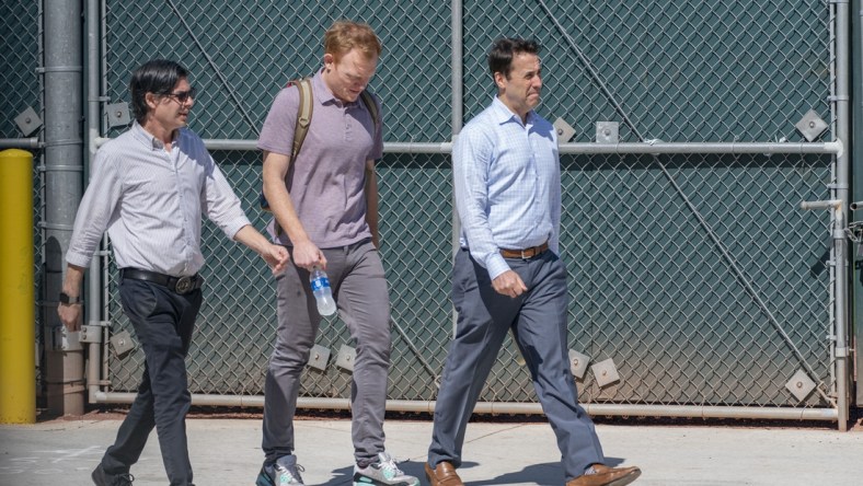 Feb 28, 2022; Jupiter, FL, USA; Deputy Commissioner Dan Halem, right, Major League Baseball Executive Vice President Morgan Sword, center, and public relations Glen Sword, left, (not part of bargaining) arrive for negotiations with the players union in an attempt to reach an agreement to salvage March 31 openers and a 162-game season, Feb. 28, 2022, at Roger Dean Stadium in  Jupiter, Florida. Mandatory Credit: Greg Lovett-USA TODAY NETWORK