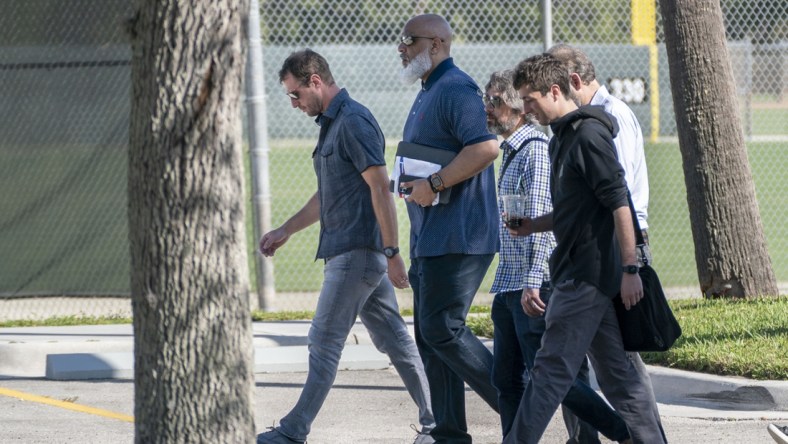 Feb 28, 2022; Jupiter, FL, USA; New York Mets pitcher Max Scherzer, far left, Major League Baseball Players Association executive director Tony Clark, second from left, arrive for negotiations with the players union in an attempt to reach an agreement to salvage March 31 openers and a 162-game season, Feb. 28, 2022, at Roger Dean Stadium in  Jupiter, Florida. Mandatory Credit: Greg Lovett-USA TODAY NETWORK