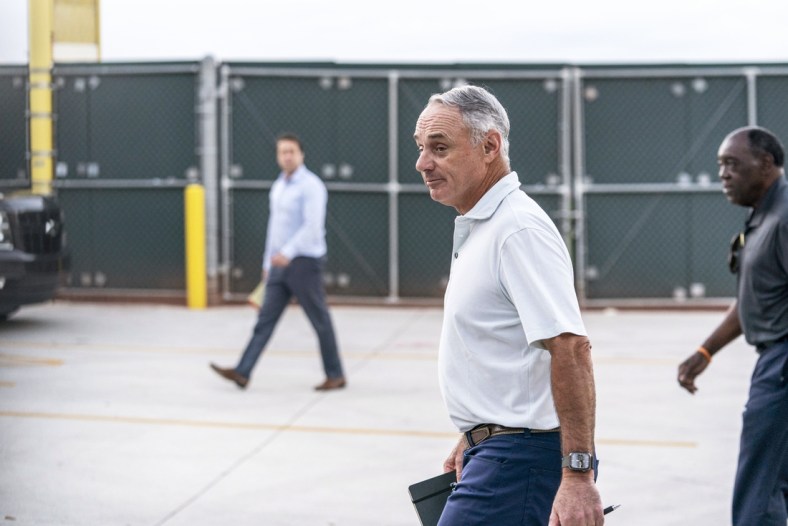 Feb 28, 2022; Jupiter, FL, USA; Major League Baseball Commissioner Rob Manfred, center, walks after negotiations with the players association in an attempt to reach an agreement to salvage March 31 openers and a 162-game season, Monday, Feb. 28, 2022, at Roger Dean Stadium in Jupiter, Fla. Mandatory Credit: Greg Lovett-USA TODAY NETWORK