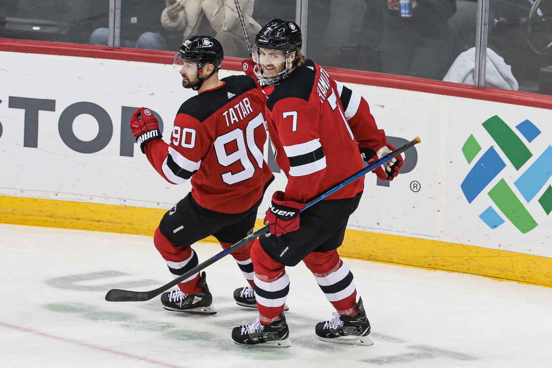 Feb 28, 2022; Newark, New Jersey, USA; New Jersey Devils defenseman Dougie Hamilton (7) celebrates his goal with left wing Tomas Tatar (90) during the third period against the Vancouver Canucks at Prudential Center. Mandatory Credit: Vincent Carchietta-USA TODAY Sports