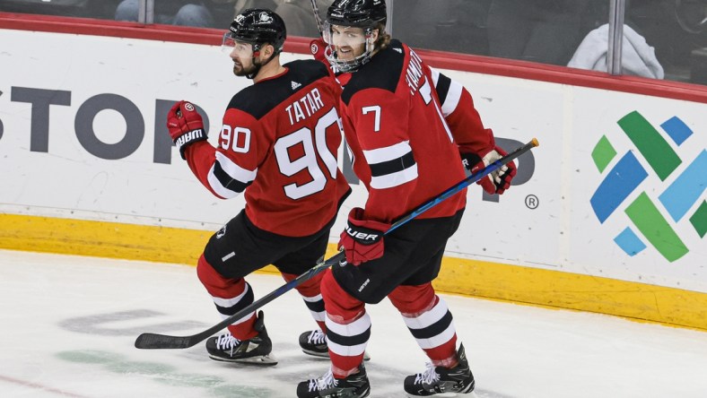 Feb 28, 2022; Newark, New Jersey, USA; New Jersey Devils defenseman Dougie Hamilton (7) celebrates his goal with left wing Tomas Tatar (90) during the third period against the Vancouver Canucks at Prudential Center. Mandatory Credit: Vincent Carchietta-USA TODAY Sports