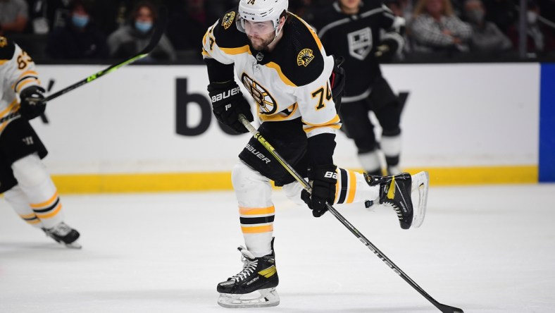 Feb 28, 2022; Los Angeles, California, USA; Boston Bruins left wing Jake DeBrusk (74) scores a goal against the Los Angeles Kings during the first period at Crypto.com Arena. Mandatory Credit: Gary A. Vasquez-USA TODAY Sports