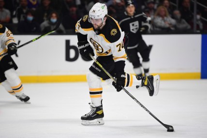 Feb 28, 2022; Los Angeles, California, USA; Boston Bruins left wing Jake DeBrusk (74) scores a goal against the Los Angeles Kings during the first period at Crypto.com Arena. Mandatory Credit: Gary A. Vasquez-USA TODAY Sports