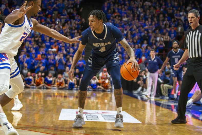 Mar 1, 2022; Boise, Idaho, USA; Nevada Wolf Pack guard Desmond Cambridge Jr. (4) dribbles during the first half of play versus Boise State Broncos at ExtraMile Arena.  Mandatory Credit: Brian Losness-USA TODAY Sports
