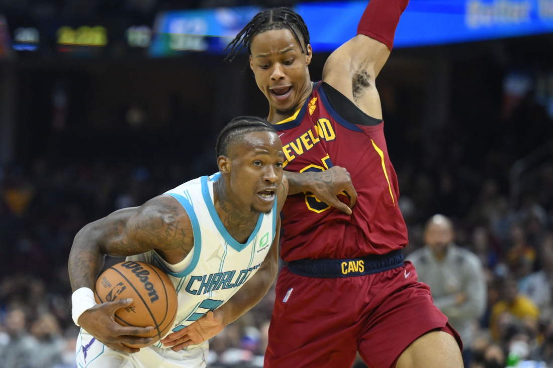 Mar 2, 2022; Cleveland, Ohio, USA; Charlotte Hornets guard Terry Rozier (3) drives against Cleveland Cavaliers forward Isaac Okoro (35) in the second quarter at Rocket Mortgage FieldHouse. Mandatory Credit: David Richard-USA TODAY Sports