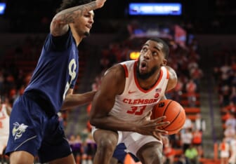 Mar 2, 2022; Clemson, South Carolina, USA; Clemson Tigers forward Naz Bohannon (33) moves to the basket against Georgia Tech Yellow Jackets guard Michael Devoe (0)  during the second half at Littlejohn Coliseum. Mandatory Credit: Dawson Powers-USA TODAY Sports