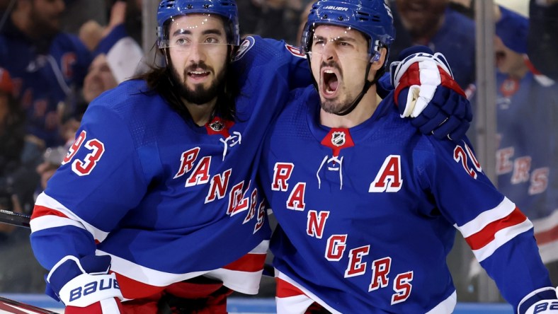 Mar 2, 2022; New York, New York, USA; New York Rangers left wing Chris Kreider (20) celebrates his goal against the St. Louis Blues with center Mika Zibanejad (93) during the third period at Madison Square Garden. The Rangers defeated the Blues 5-3. Mandatory Credit: Brad Penner-USA TODAY Sports