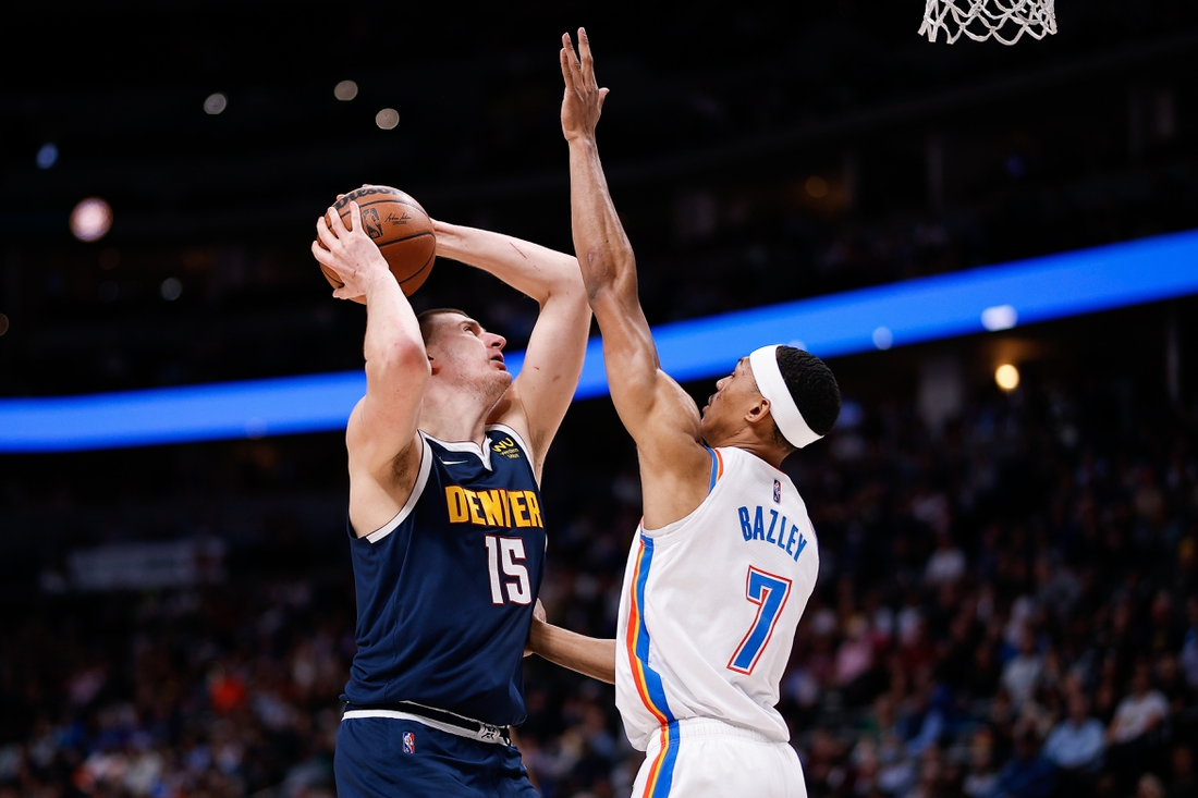 Mar 2, 2022; Denver, Colorado, USA; Denver Nuggets center Nikola Jokic (15) attempts a shot against Oklahoma City Thunder forward Darius Bazley (7) in the second quarter at Ball Arena. Mandatory Credit: Isaiah J. Downing-USA TODAY Sports