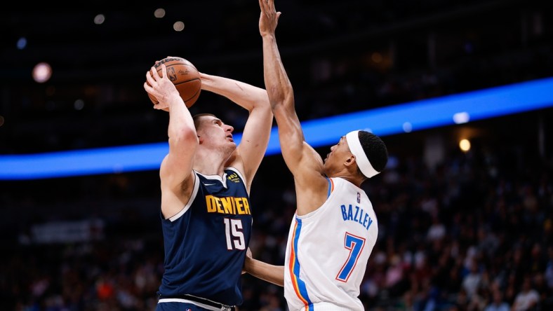 Mar 2, 2022; Denver, Colorado, USA; Denver Nuggets center Nikola Jokic (15) attempts a shot against Oklahoma City Thunder forward Darius Bazley (7) in the second quarter at Ball Arena. Mandatory Credit: Isaiah J. Downing-USA TODAY Sports