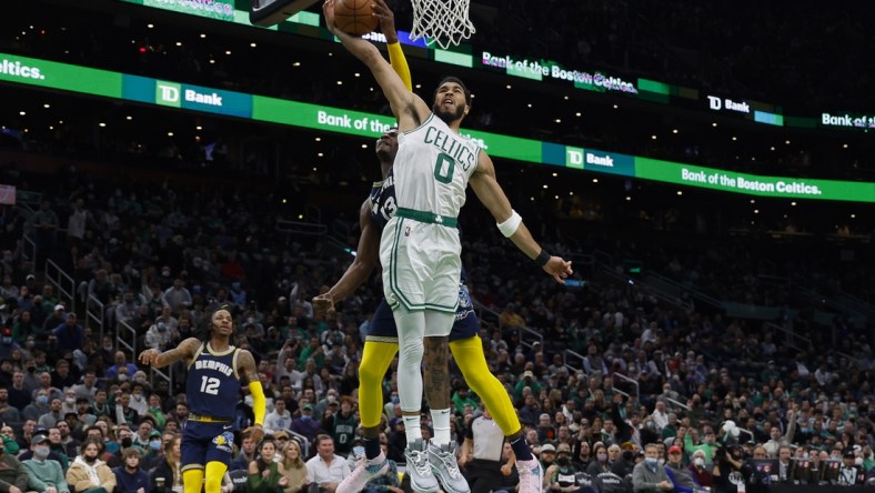 Mar 3, 2022; Boston, Massachusetts, USA; Memphis Grizzlies forward Jaren Jackson Jr. (13) blocks a shot attempt by Boston Celtics forward Jayson Tatum (0) during the first quarter at TD Garden. Mandatory Credit: Winslow Townson-USA TODAY Sports