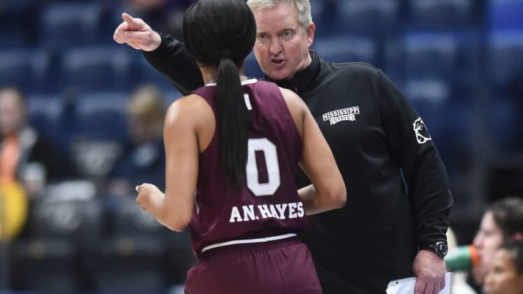 Mississippi State interim basketball coach Doug Novak talks with guard Anastasia Hayes (0) during the SEC Women's Basketball Tournament game against Kentucky in Nashville, Tenn. on Thursday, March 3, 2022.Miss St Ky Sec
