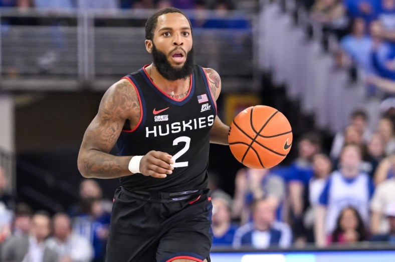 Mar 2, 2022; Omaha, Nebraska, USA;  Connecticut Huskies guard R.J. Cole (2) dribbles against the Creighton Bluejays in the first half at CHI Health Center Omaha. Mandatory Credit: Steven Branscombe-USA TODAY Sports