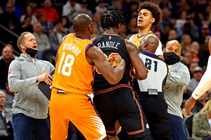 Mar 4, 2022; Phoenix, Arizona, USA; Phoenix Suns forward Cameron Johnson (23) and New York Knicks forward Julius Randle (30) have to be broken up during the second half at Footprint Center. Mandatory Credit: Mark J. Rebilas-USA TODAY Sports