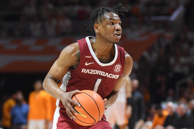 Arkansas guard JD Notae (1) dribbles the ball during the final regular season game between Tennessee and Arkansas at Thompson-Boling Arena in Knoxville, Tenn., Saturday, March 5, 2022. Tennessee defeated Arkansas 78-74.

Utark0305 1551
