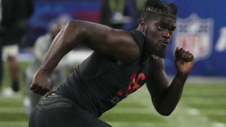 Mar 5, 2022; Indianapolis, IN, USA; Michigan defensive lineman David Ojabo (DL36) goes through drills during the 2022 NFL Scouting Combine at Lucas Oil Stadium. Mandatory Credit: Kirby Lee-USA TODAY Sports