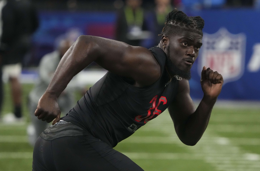 Mar 5, 2022; Indianapolis, IN, USA; Michigan defensive lineman David Ojabo (DL36) goes through drills during the 2022 NFL Scouting Combine at Lucas Oil Stadium. Mandatory Credit: Kirby Lee-USA TODAY Sports