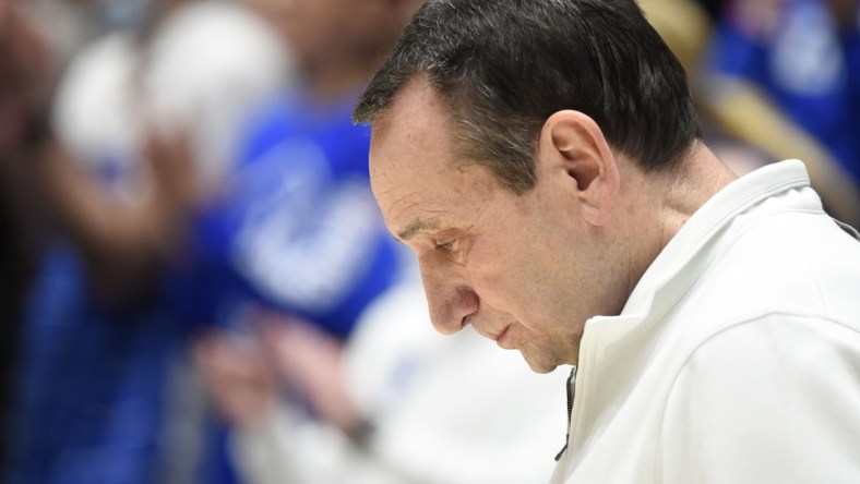 Mar 5, 2022; Durham, North Carolina, USA; Duke Blue Devils head coach Mike Krzyzewski bows his head during the national anthem prior to a game against the North Carolina Tar Heels at Cameron Indoor Stadium. Mandatory Credit: Rob Kinnan-USA TODAY Sports