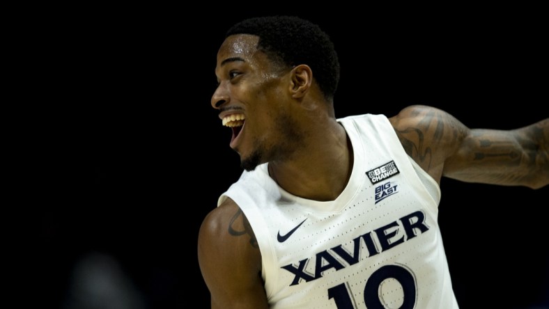 Mar 5, 2022; Cincinnati, OH, USA; Xavier Musketeers guard Nate Johnson (10) celebrates after hitting a three-point basket  against the Georgetown Hoyas in the first half at the Cintas Center. Mandatory Credit: Albert Cesare/The Cincinnati Enquirer Sentinel via USA TODAY NETWORK