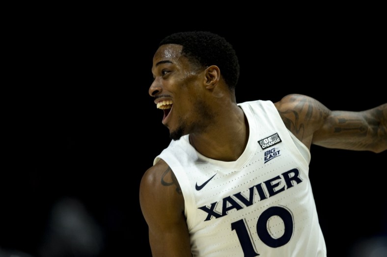 Mar 5, 2022; Cincinnati, OH, USA; Xavier Musketeers guard Nate Johnson (10) celebrates after hitting a three-point basket  against the Georgetown Hoyas in the first half at the Cintas Center. Mandatory Credit: Albert Cesare/The Cincinnati Enquirer Sentinel via USA TODAY NETWORK