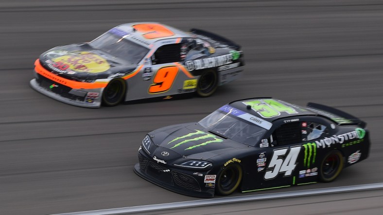 Mar 5, 2022; Las Vegas, Nevada, USA; NASCAR Xfinity Series driver Ty Gibbs (54) and driver Noah Gragson (9) race for position during the Alsco Uniforms 300 at Las Vegas Motor Speedway. Mandatory Credit: Gary A. Vasquez-USA TODAY Sports