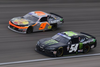 Mar 5, 2022; Las Vegas, Nevada, USA; NASCAR Xfinity Series driver Ty Gibbs (54) and driver Noah Gragson (9) race for position during the Alsco Uniforms 300 at Las Vegas Motor Speedway. Mandatory Credit: Gary A. Vasquez-USA TODAY Sports