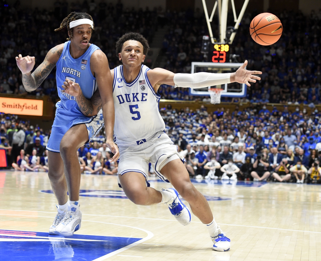 Mar 5, 2022; Durham, North Carolina, USA; Duke Blue Devils forward Paolo Banchero (5) loses the ball out of bounds as he drives to the basket with North Carolina Tar Heels forward Armando Bacot (5) defending during the second half  at Cameron Indoor Stadium.  The Tar Heels won 94-81. Mandatory Credit: Rob Kinnan-USA TODAY Sports