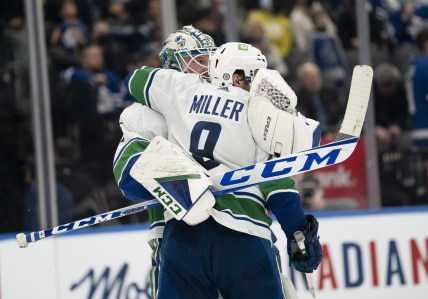 Mar 5, 2022; Toronto, Ontario, CAN; Vancouver Canucks goaltender Thatcher Demko (35) celebrates the win with center J.T. Miller (9) at the end of the third period against the Toronto Maple Leafs at Scotiabank Arena. Mandatory Credit: Nick Turchiaro-USA TODAY Sports