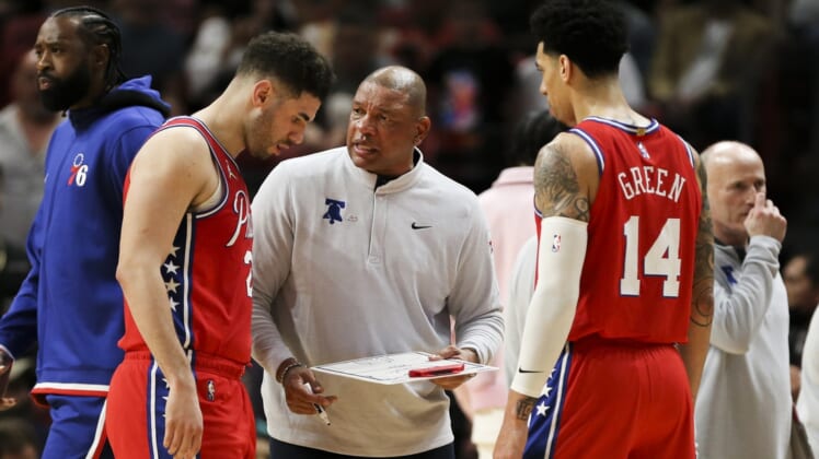 Mar 5, 2022; Miami, Florida, USA; Philadelphia 76ers head coach Doc Rivers talks to forward Georges Niang (20) and forward Danny Green (14) during a timeout in the fourth quarter against the Miami Heat at FTX Arena. Mandatory Credit: Sam Navarro-USA TODAY Sports