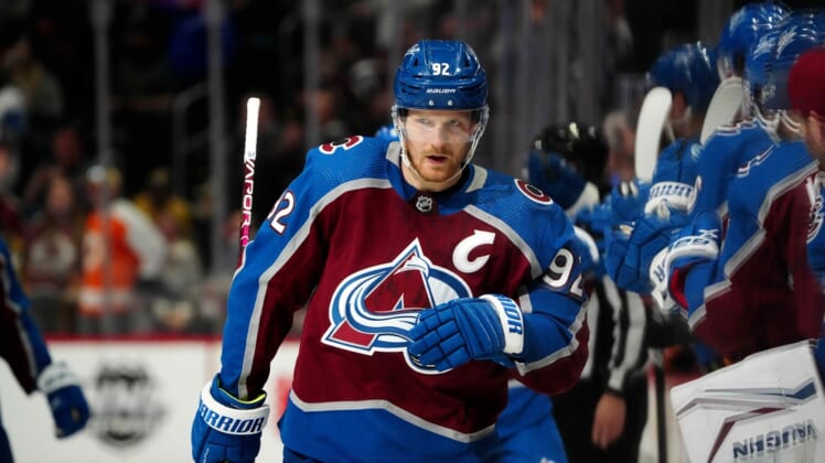 Mar 5, 2022; Denver, Colorado, USA; Colorado Avalanche left wing Gabriel Landeskog (92) celebrates his first period  goal against the Calgary Flames at Ball Arena. Mandatory Credit: Ron Chenoy-USA TODAY Sports