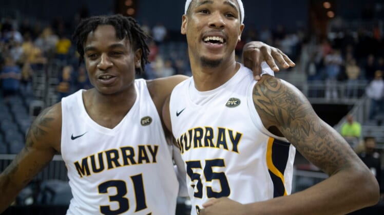 Murray State's Jordan Skipper-Brown (31), left ,and  DJ Burns (55) celebrate their win following the 2022 Ohio Valley Conference Basketball Championship at the Ford Center in Evansville, Ind., Saturday night, March 5, 2022. The Murray State Racers earned a 71-67 win over the Morehead State Eagles.Gp030522ovcmens0020