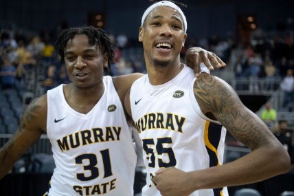 Murray State's Jordan Skipper-Brown (31), left ,and  DJ Burns (55) celebrate their win following the 2022 Ohio Valley Conference Basketball Championship at the Ford Center in Evansville, Ind., Saturday night, March 5, 2022. The Murray State Racers earned a 71-67 win over the Morehead State Eagles.

Gp030522ovcmens0020