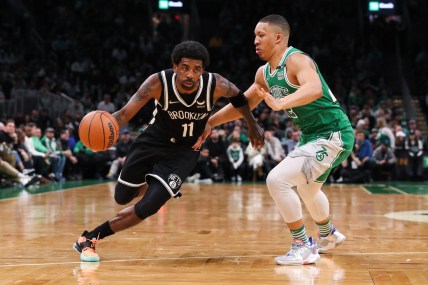 Mar 6, 2022; Boston, Massachusetts, USA; Brooklyn Nets guard Kyrie Irving (11) drives to the basket during the first half against the Boston Celtics at TD Garden. Mandatory Credit: Paul Rutherford-USA TODAY Sports