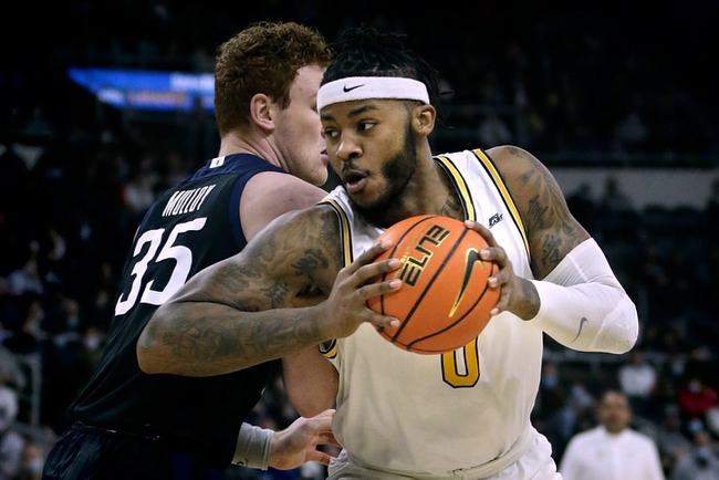 Friars center, Nate Watson, twist behind Bulldog center John-Michael Mulloy under the Providence net.

Syndication The Providence Journal