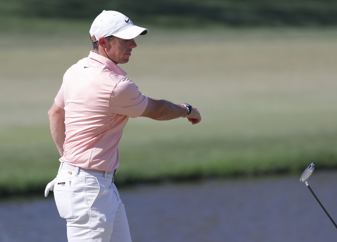 Mar 6, 2022; Orlando, Florida, USA; Rory McIlroy throws his putter toward the lake after missing a putt on the eighth green during the final round of the Arnold Palmer Invitational golf tournament. Mandatory Credit: Reinhold Matay-USA TODAY Sports