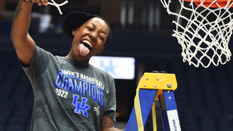 Mar 6, 2022; Nashville, TN, USA; Kentucky Wildcats forward Dre'una Edwards (44) celebrates after cutting a piece of the net after beating the South Carolina Gamecocks at Bridgestone Arena. Mandatory Credit: Christopher Hanewinckel-USA TODAY Sports