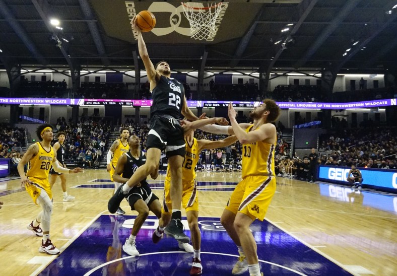 Mar 6, 2022; Evanston, Illinois, USA; Minnesota Golden Gophers guard Jackson Purcell (11) defends Northwestern Wildcats forward Pete Nance (22) during the first half at Welsh-Ryan Arena. Mandatory Credit: David Banks-USA TODAY Sports