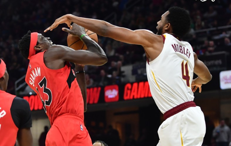 Mar 6, 2022; Cleveland, Ohio, USA; Cleveland Cavaliers center Evan Mobley (4) blocks the shot of Toronto Raptors forward Pascal Siakam (43) during the first half at Rocket Mortgage FieldHouse. Mandatory Credit: Ken Blaze-USA TODAY Sports