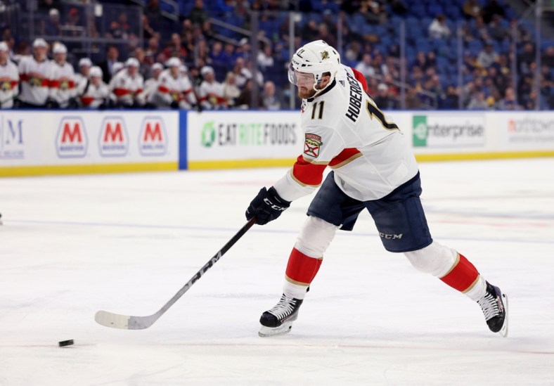Mar 7, 2022; Buffalo, New York, USA;  Florida Panthers left wing Jonathan Huberdeau (11) makes a pass during the third period against the Buffalo Sabres at KeyBank Center. Mandatory Credit: Timothy T. Ludwig-USA TODAY Sports