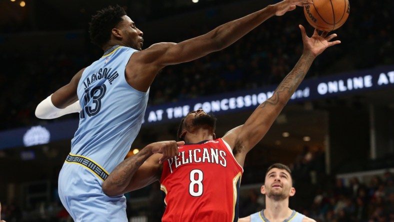 Mar 8, 2022; Memphis, Tennessee, USA; Memphis Grizzlies forward Jaren Jackson Jr. (13) blocks the shot of New Orleans Pelicans forward Naji Marshall (8) during the second half at FedExForum. Mandatory Credit: Petre Thomas-USA TODAY Sports