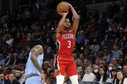 Mar 8, 2022; Memphis, Tennessee, USA; New Orleans Pelicans guard CJ McCollum (3) shoots for three during the second half against the Memphis Grizzlies at FedExForum. Mandatory Credit: Petre Thomas-USA TODAY Sports