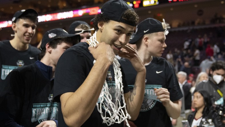 March 8, 2022; Las Vegas, NV, USA; Gonzaga Bulldogs forward Anton Watson (22) puts the net around his neck after defeating the Saint Mary's Gaels after the game in the finals of the WCC Basketball Championships at Orleans Arena. Mandatory Credit: Kyle Terada-USA TODAY Sports