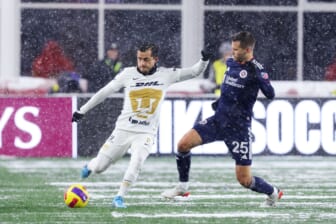 Mar 9, 2022; Foxborough, Massachusetts, USA; Pumas UNAM defender Alan Mozo (2) passes the ball defended by New England Revolution midfielder Arnor Traustason (25) during the first half at Gillette Stadium. Mandatory Credit: Paul Rutherford-USA TODAY Sports