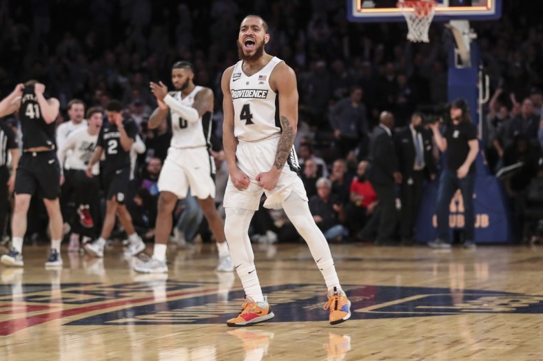 Mar 10, 2022; New York, NY, USA;  Providence Friars guard Jared Bynum (4) celebrates after defeating the Butler Bulldogs 65-61 in the Big East Tournament at Madison Square Garden. Mandatory Credit: Wendell Cruz-USA TODAY Sports