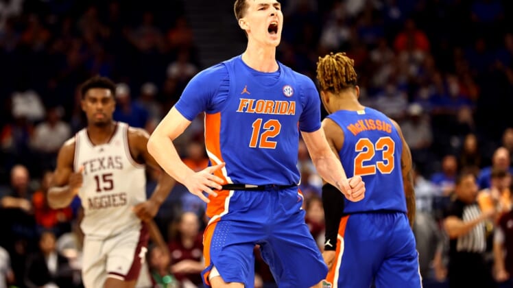 Mar 10, 2022; Tampa, FL, USA; Florida Gators forward Colin Castleton (12) gets pumped up against the Texas A&M Aggies during the first half at Amalie Arena. Mandatory Credit: Kim Klement-USA TODAY Sports