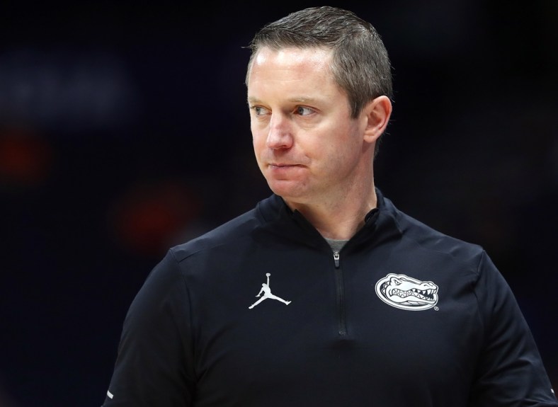 Mar 10, 2022; Tampa, FL, USA; Florida Gators head coach Mike White looks on against the Texas A&M Aggies during the first half at Amalie Arena. Mandatory Credit: Kim Klement-USA TODAY Sports