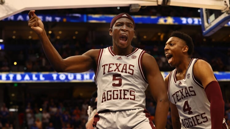 Mar 10, 2022; Tampa, FL, USA; Texas A&M Aggies guard Hassan Diarra (5) celebrates with Texas A&M Aggies guard Wade Taylor IV (4) as Diarra hit the game winning three point basket at Amalie Arena. Mandatory Credit: Kim Klement-USA TODAY Sports