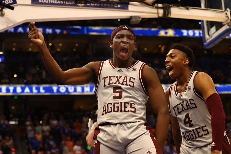 Mar 10, 2022; Tampa, FL, USA; Texas A&M Aggies guard Hassan Diarra (5) celebrates with Texas A&M Aggies guard Wade Taylor IV (4) as Diarra hit the game winning three point basket at Amalie Arena. Mandatory Credit: Kim Klement-USA TODAY Sports