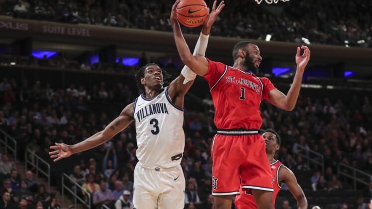 Mar 10, 2022; New York, NY, USA; Villanova Wildcats forward Brandon Slater (3) and St. John's Red Storm forward Aaron Wheeler (1) battle for a rebound in the first half at the Big East Tournament at Madison Square Garden. Mandatory Credit: Wendell Cruz-USA TODAY Sports